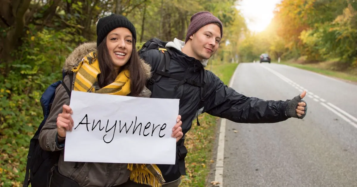 Hitchhikers with a sign in Canada