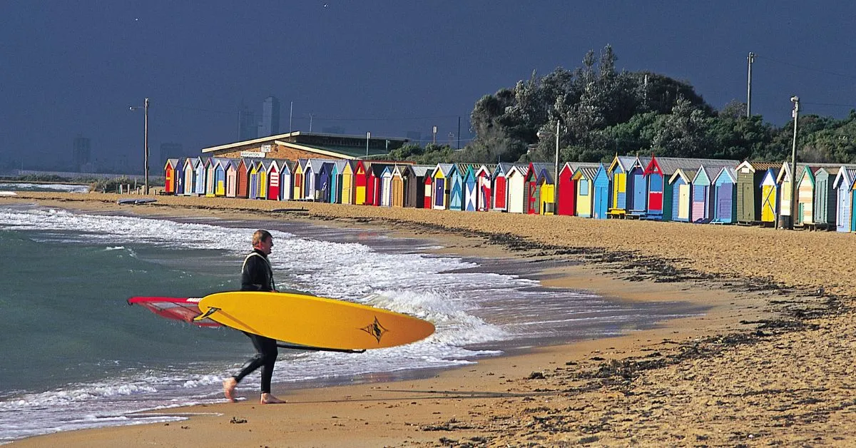 Man with a surfboard on an Australian beach