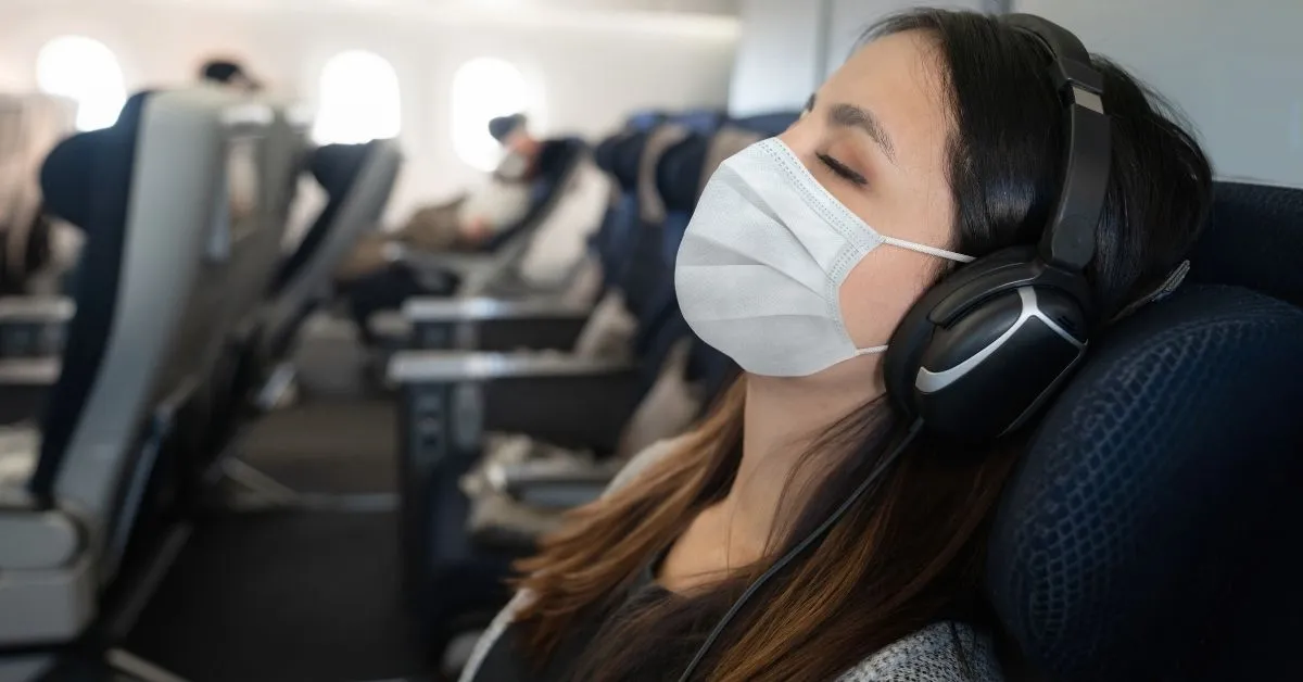 woman sleeping on a plane
