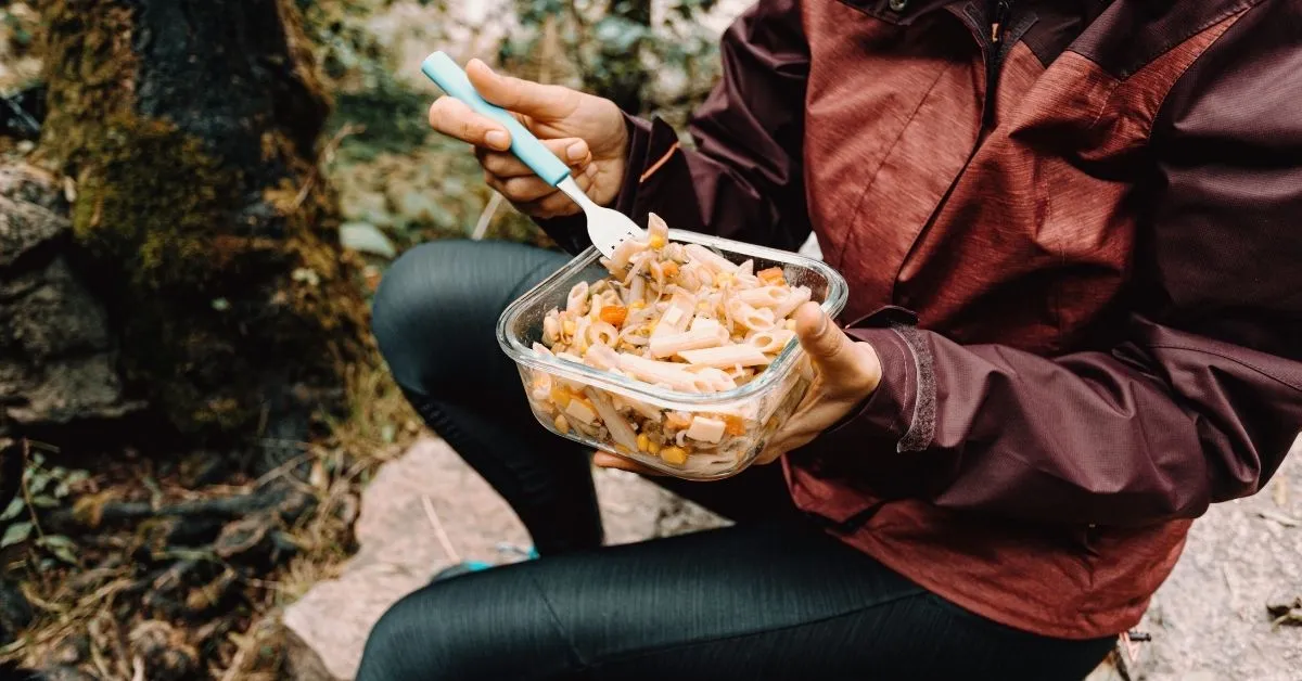 Hiker eating a pasta salad