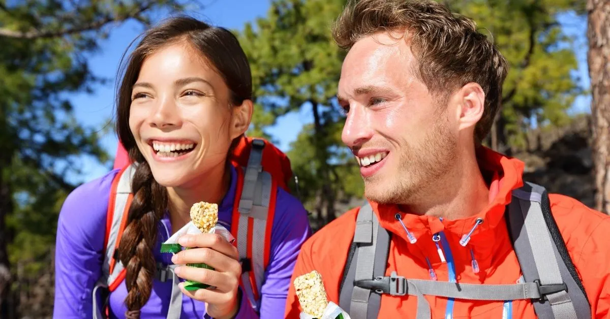 Hikers eating granola bars