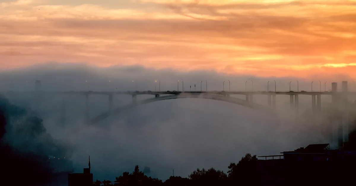 Ponte da Arrábida bridge Porto with fog during sunset