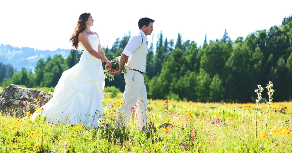 eloping couple in wedding dress and suit in the mountains of colorado