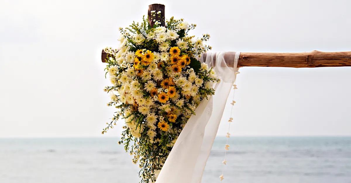 wedding arch flowers on beach
