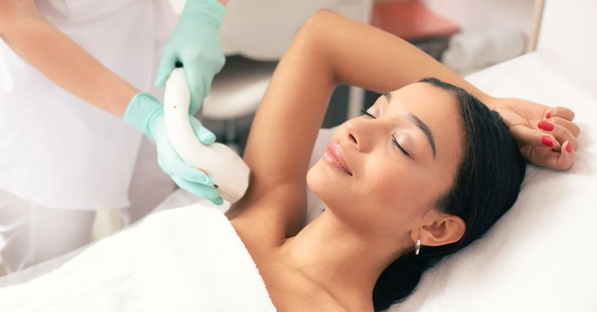 Woman getting laser hair removal treatment