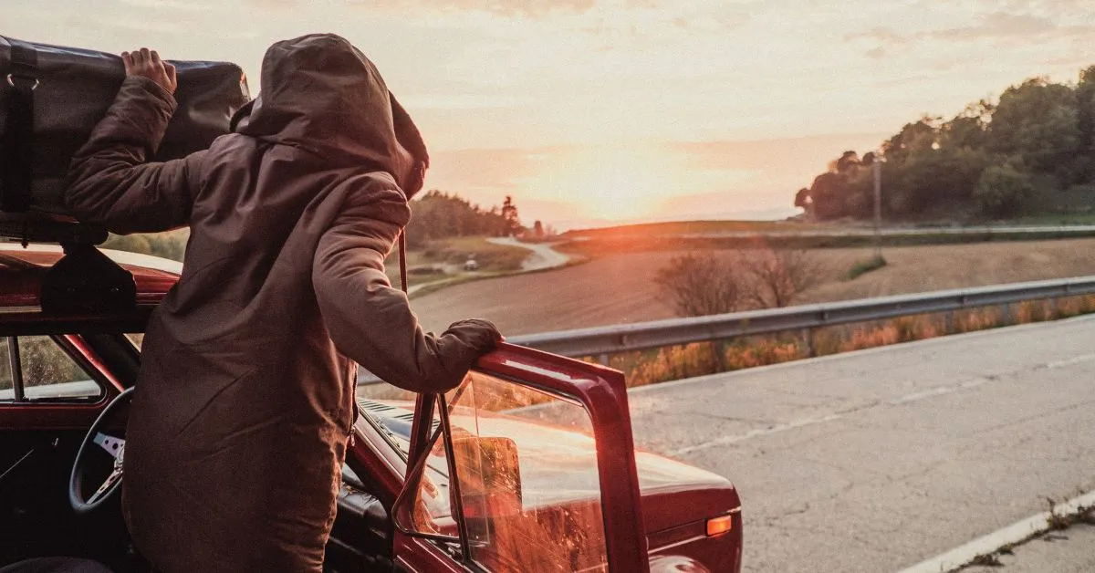 Woman in a jeep on a road trip