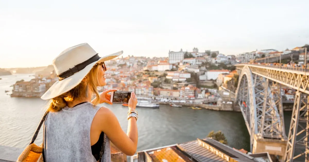 Traveler taking a photo in Porto