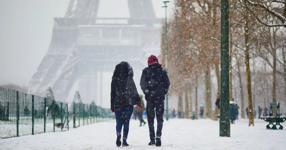 Couple traveling in Paris during winter