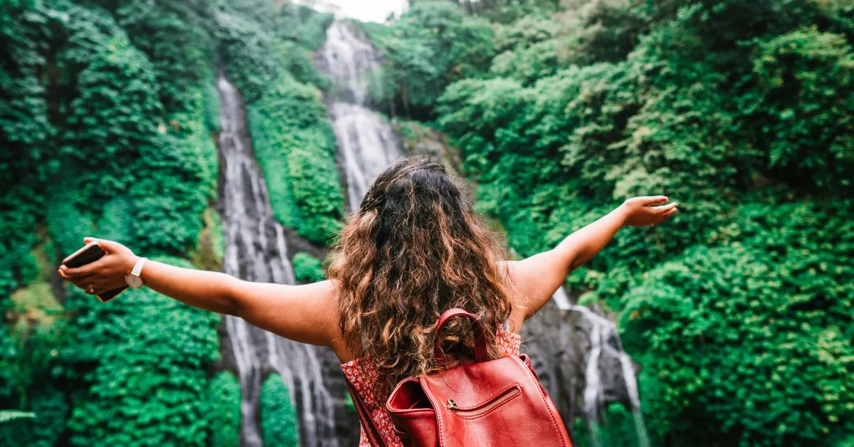 Traveler at a waterfall