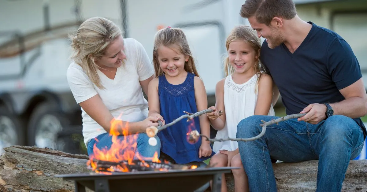 Family around a bonfire during their RV holidays