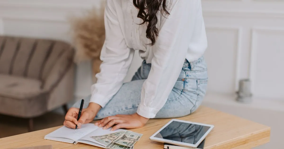 Woman making a budget to travel